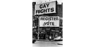 Billboards at the corner of Christopher St. and Seventh Ave., Greenwich Village, New York that read: Gay Rights, Register to Vote