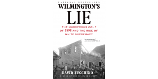 Book cover of David Zucchino's Wilmington's Lie featuring a historic photo of men posing in front of a burning building