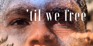 A close up shot of a person's face with grains of sand on it and the words 'Til We Free