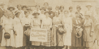 Photograph of Black women suffragists holding sign reading Head-Quarters for Colored Women Voters, in Georgia, c. 1910–1920.