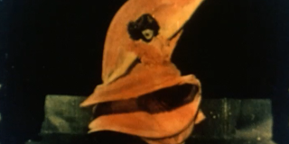 Woman dancing in an orange dress