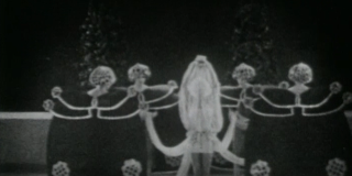 Still from black and white movie featuring dancers