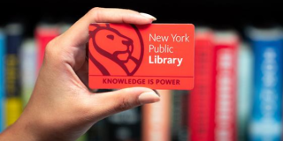 hand holding a library card